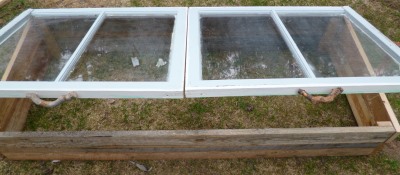 Two old windows, complete with glass, make the lids